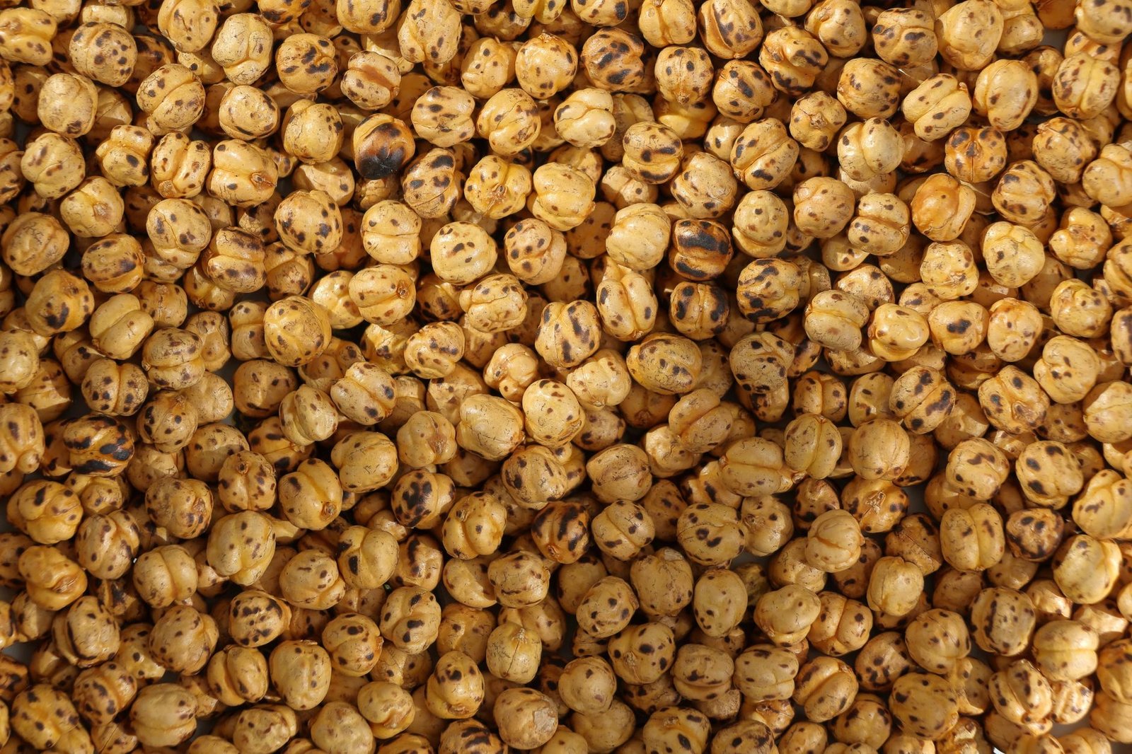 Texture of roasted chickpeas - a healthy snack option.