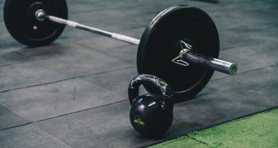 Barbell and kettlebell on gym floor, ideal for fitness and strength training themes.